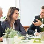 34889701_-_business_people_laughing_during_business_appointment_in_the_office