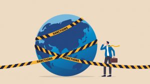 World_economic_sanctions,_force_country_to_obey_international_law_by_limit_or_stop_trading_concept,_businessman_look_at_planet_earth_world_country_with_prohibited_yellow_tape_with_word_sanctions.