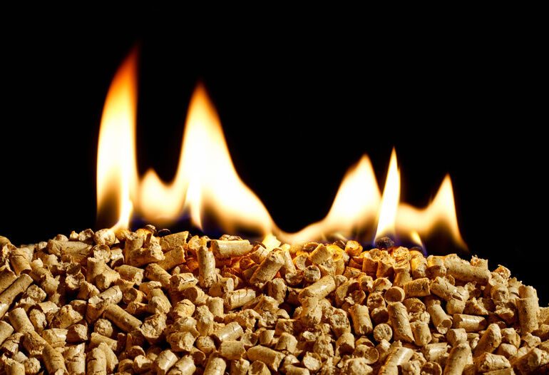 burning_wood_chip_pellets_a_renewable_source_of_energy_becoming_popular_as_a_green_environmentally_friendly_fuel_for_stoves_which_provide_household_heating