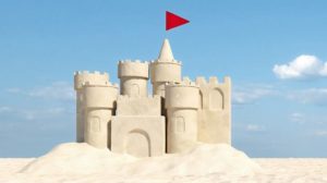 Beautiful_sandcastle_on_the_beach_with_sand_on_summer_vacation_(3d_rendering)