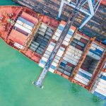 Aerial_top_view_container_cargo_ship,_Business_import_export_logistic_and_transportation_of_International_by_containr_cargo_ship_in_the_open_sea.