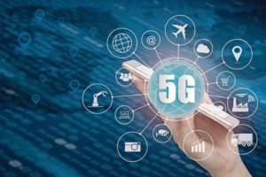 5G_network_wireless_systems_and_internet_of_things,_Smart_city_and_communication_network_with_smartphone_in_hand_and_objects_icon_connecting_together,__Connect_global_wireless_devices.